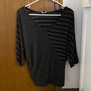 Black and grey striped three quarter length shirt.